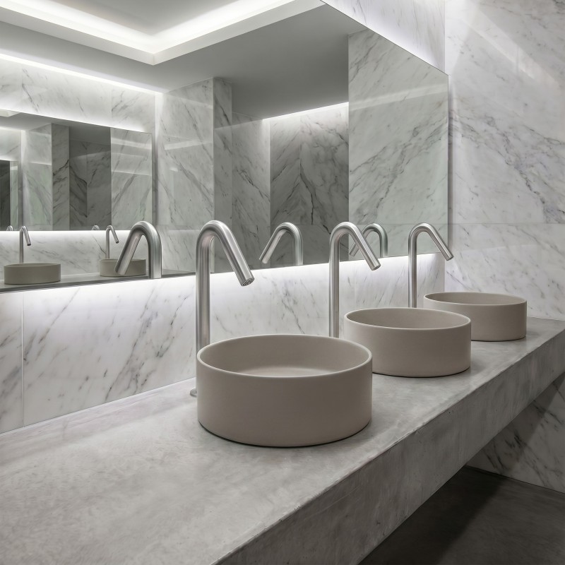 Sleek designer brushed stainless steel 316 ONE tap with elevated spout for contemporary bathroom spaces Sleek designer brushed stainless steel 316 ONE tap with elevated spout for contemporary bathroom spaces
