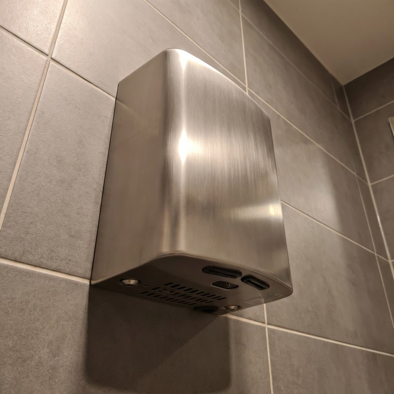 Brushed stainless steel POCK’AIR hand dryer with minimalist design and high-speed airflow Brushed stainless steel POCK’AIR hand dryer with minimalist design and high-speed airflow