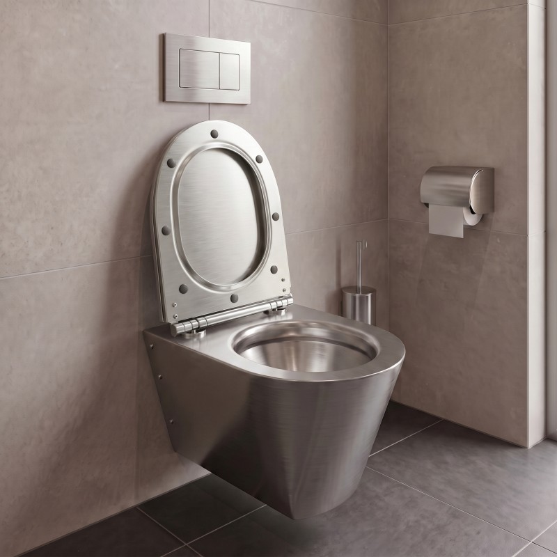 Asiento de inodoro de acero inoxidable con tapa para aseos de uso público. Asiento de inodoro de acero inoxidable con tapa para aseos de uso público.
