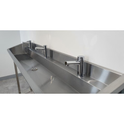 Freestanding stainless steel washbasin with tap platform and credenza