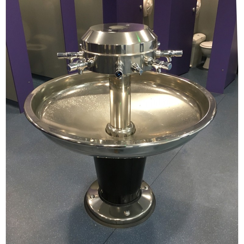 Circular washbasin on a central stand for communal sanitary facilities