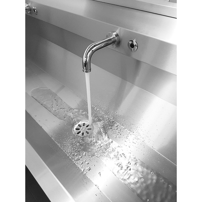 Stainless steel communal sink with backsplash and integrated faucets