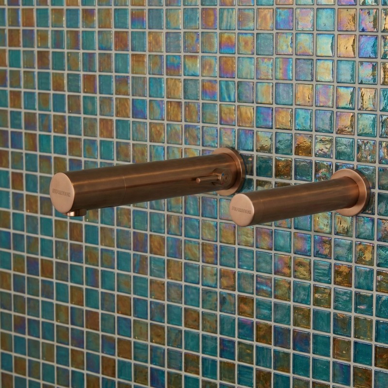 A refined bathroom space, enhanced by copper electronic faucetry A refined bathroom space, enhanced by copper electronic faucetry