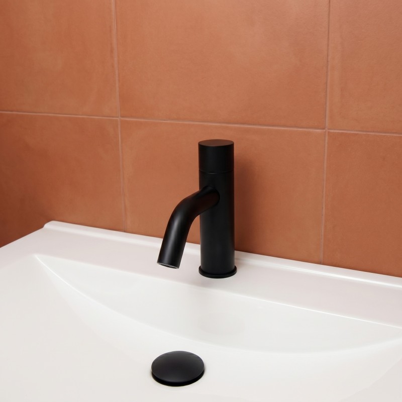 Matte black faucet with concealed motion sensor in the spout tip, ultra-modern design Matte black faucet with concealed motion sensor in the spout tip, ultra-modern design