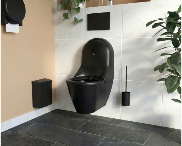 Inodoro negro suspendido autolimpiante HYGISEAT en un baño moderno, azulejos claros, suelo de pizarra y accesorios negros, con plantas verdes.